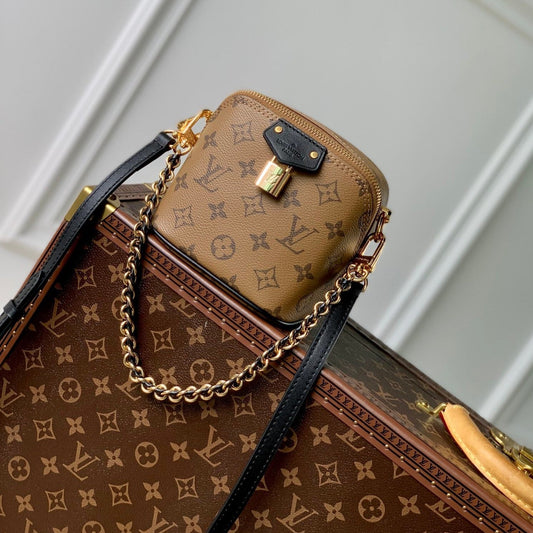 Louis Vuitton just in case 13cm beige monogram canvas black calfskin