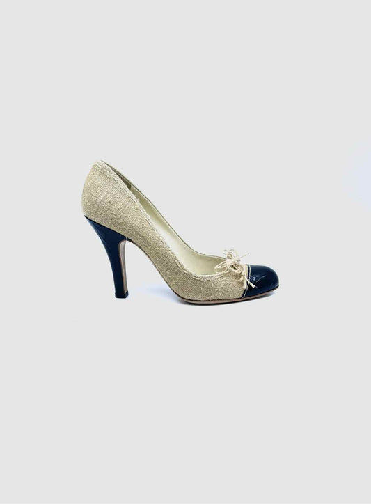 PRADA Size 9 Black, beige Canvas Solid Pumps